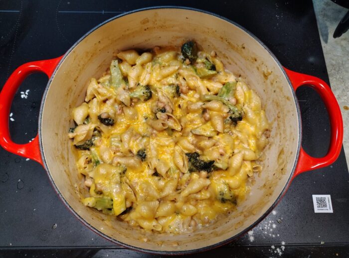 a pot of what is essentially macaroni and cheese with broccoli and beans