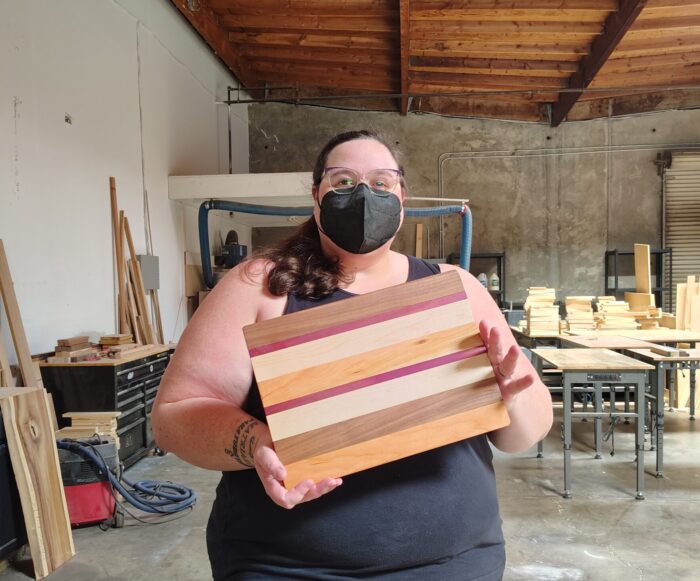me in the woodshop modeling my new cutting board
