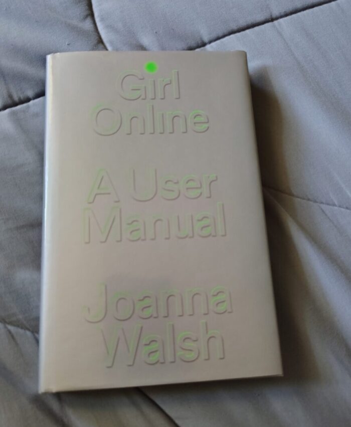 hardcover book Girl Online: A User Manual. Cover is silver with light green text