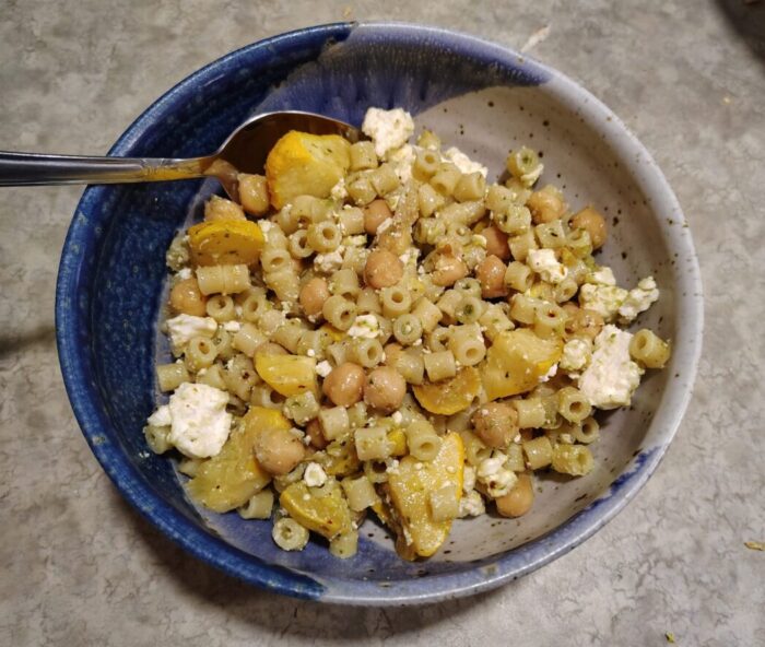 a bowl of roasted yellow squash, chickpeas, feta, and ditalini noodles