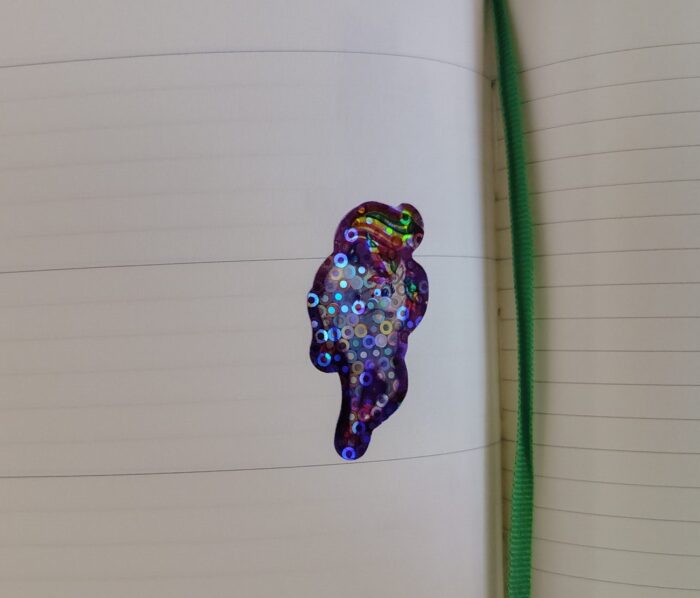 a very sparkly unicorn sticker in my planner