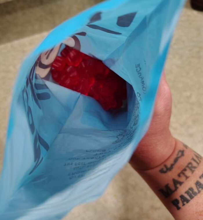 camera view inside a bag of all-red gummy bears