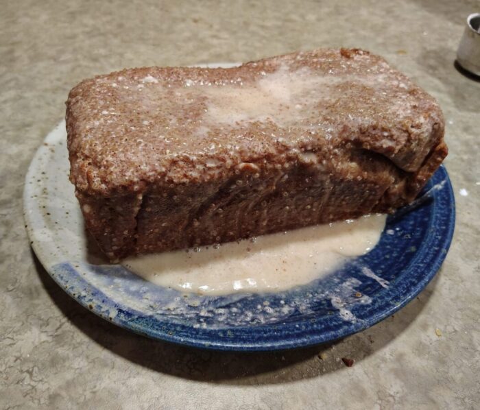a loaf of sweet bread glazed thoroughly like a donut
