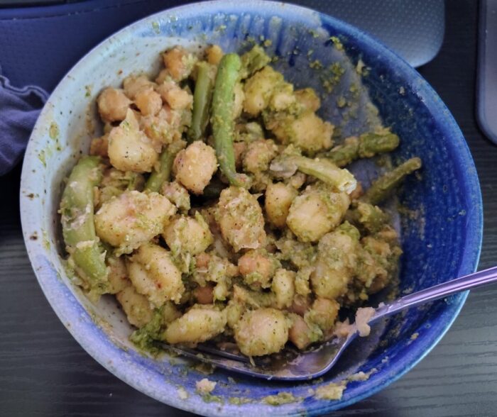 a bowl of gnocchi, chickpeas, green beans, and pest